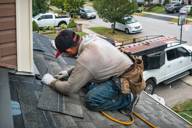Professional Roofing technician working in Orient, IA